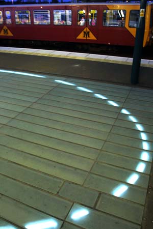 ‘White Light’, cathode tubing under glass block floor, by Ron Haselden, 2002. St. Peter’s Metro Station, Sunderland.