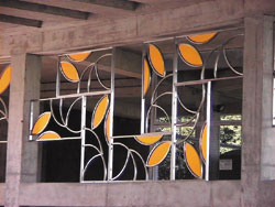 Metal screen of reflective modular shapes. Artist: Penny Robbins.