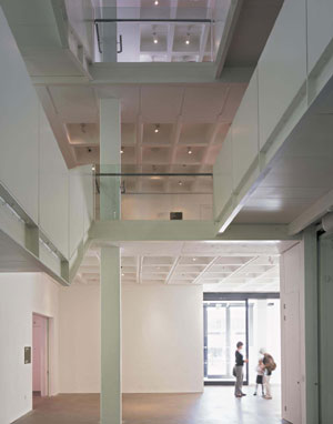 View of the new triple height entrance hall looking towards the main entrance sliding doors. Arnolfini, Bristol.  Designed by architects Snell Associates with artist Susanna Heron, 1998 -2005. Photo: Dennis Gilbert/ VIEW