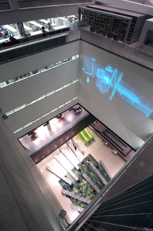 Seattle Central Library Atrium, showing (above) Astronomy by Day (and other oxymorons), video projection by Gary Hill, 2004, and (below) Garden Carpet by Petra Blaisse, 2004. Photo courtesy of The Seattle Central Library.