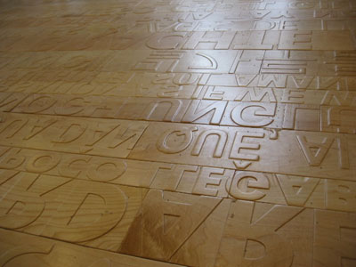 Floor of Babble (detail), Maplewood floor by Ann Hamilton, 2004. Foreign language resources section, Seattle Central Library. Photo courtesy of The Seattle Central Library.