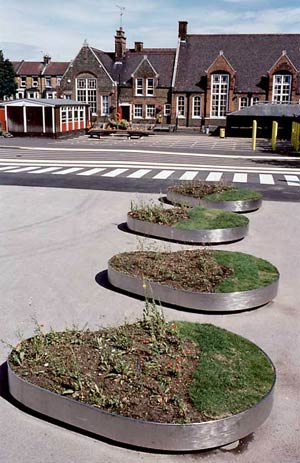 Moving planters designed by artist Hattie Coppard and Kinnear Landscape Architects, 2003. Daubeney Primary School, London E5. Photo: Michael Franke