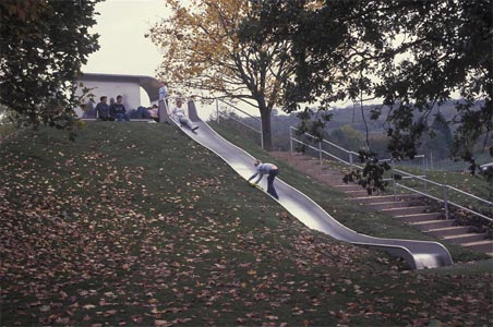 Shelter and slide in stainless steel, Spacemakers' public space, Hartcliffe, Bristol. Landscape Architect, Loci Design, shelter co-designed with sculptor Calum Stirling, 2004. Photo: Loci Design.