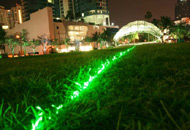 Emerald Laser Lawn, Dan Corson, 2007 Huzienga Plaza, Broward County, Florida, USA. Green lasers at low level playing out patterns across the lawn. Photo: Dan Corson.