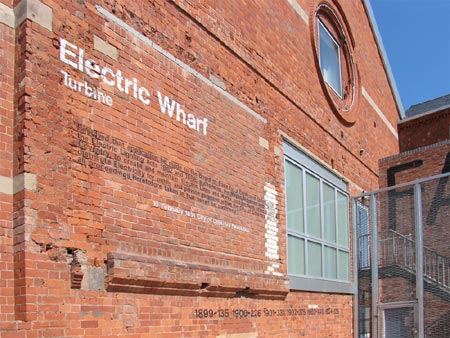 Electric Wharf site showing lettering on buildings, lead artist David Patten and Larry Priest of Bryant Priest Newman Architects. Electric Wharf, Coventry, 2001 - 2006. Photo: Larry Priest.