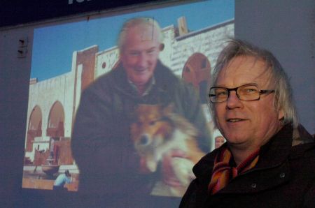 Film-maker Jean Bei Ning in front of his film projected onto the ice house in Peterhead, March 2006. Photograph by Sans façon.