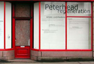 A shop on Kirk Street, Peterhead, that was cleaned up and which had proposals for the area displayed on the windows, using vinyl lettering, by Sans façon, summer 2005. Photograph by Sans façon.