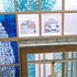 Link to larger image: Foyer of Wellspring Healthy Living Centre, Barton Hill, Bristol: Reception desk and staircase by Walter Jack, floor by Marion Brandis, window by Anne Smyth, and sculpture, Reg, by Lucy Casson.