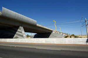 Kwinana Freeway Bridge abutment walls and marker lights on loop road above, designed by Anne Neil, 2006. Roe Highway 7, Western Australia. Photo: Peter Zuvela.