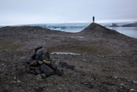 Alex Hartley stands on Nyskjaeret, origin of Nowhereisland Photo: Max McClure